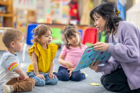 Young children react at library storytime