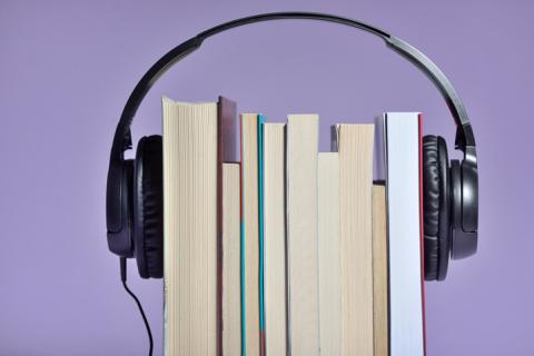 Headphones around a group of books